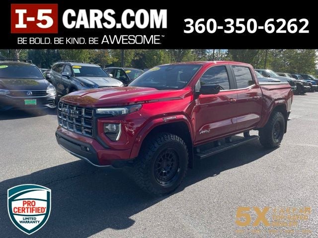 2024 GMC Canyon AT4 in Volcanic Red Tintcoat — front three-quarter view
