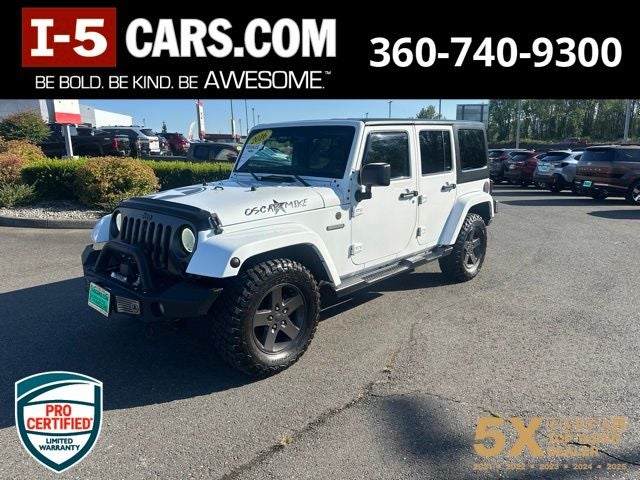 2016 Jeep Wrangler Unlimited Sport in Bright White Clearcoat — front three-quarter view