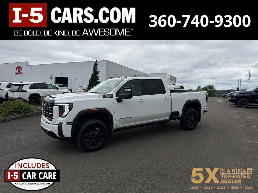 2024 GMC Sierra 3500HD AT4 in Summit White — front three-quarter view