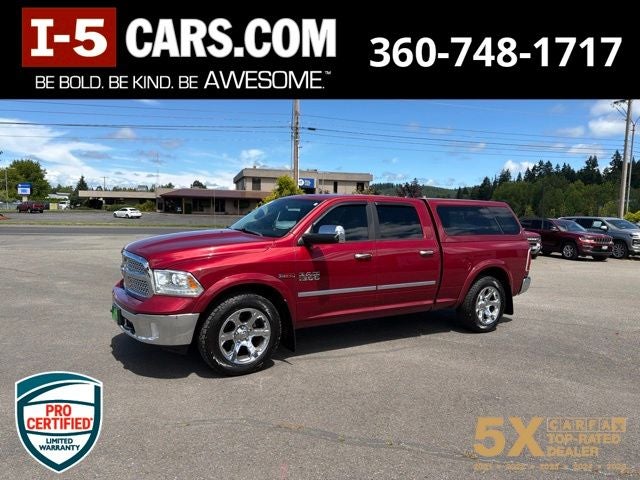 2014 RAM 1500 Laramie in Deep Cherry Red Crystal Pearlcoat — front three-quarter view