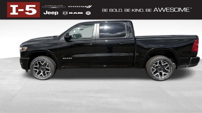 2026 RAM Ram 1500 RAM 1500 LARAMIE CREW CAB 4X4 5'7' BOX in Diamond Black Crystal Pearl-Coat Exterior Paint — front three-quarter view