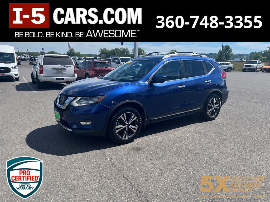 2017 Nissan Rogue SL in Caspian Blue — front three-quarter view