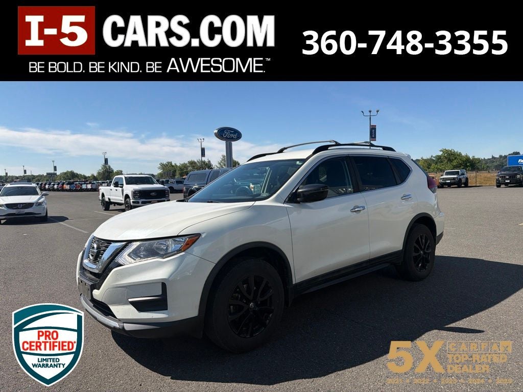 2017 Nissan Rogue SV in Pearl White — front three-quarter view